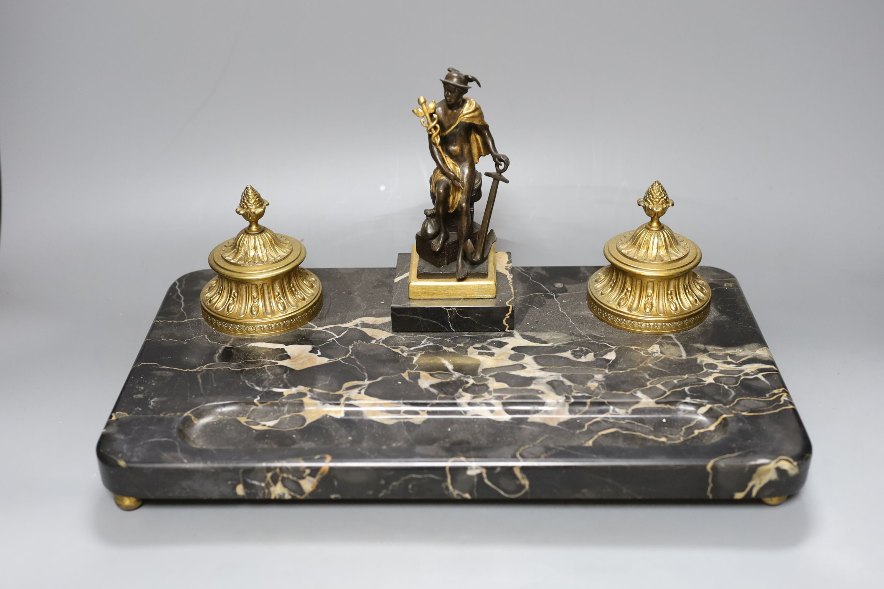 A bronze and marble ‘mercury’ inkstand, 40cm wide